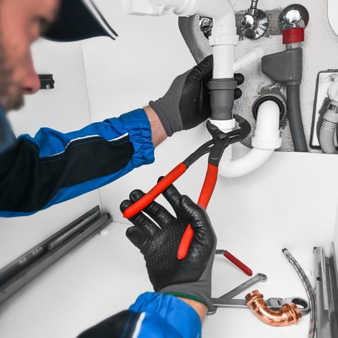 Plumber,Working,In,Kitchen,,Repair,Man,Service,,Repairing,Leaking,Water Plumber,Working,In,Kitchen,,Repair,Man,Ser